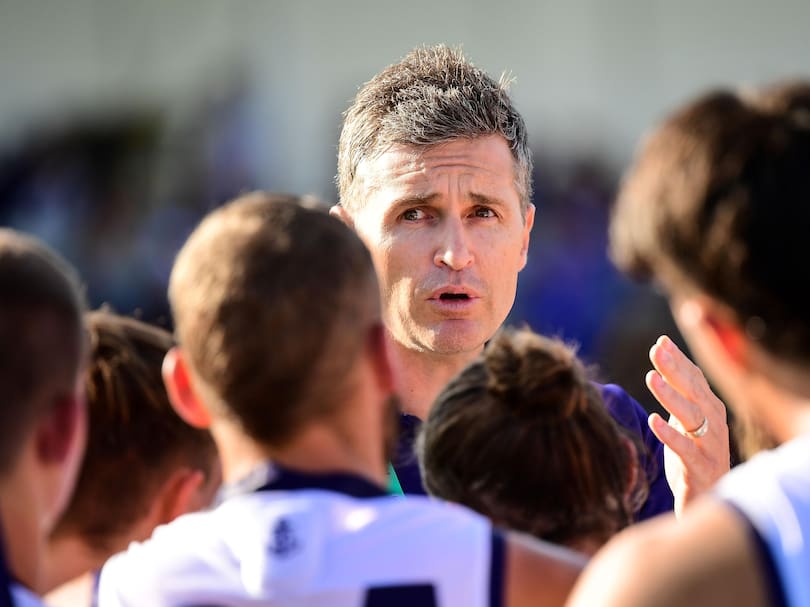 Justin Longmuir, coach of the Dockers coach addresses the team at the quarter time break during the 2020 Marsh Community Series.