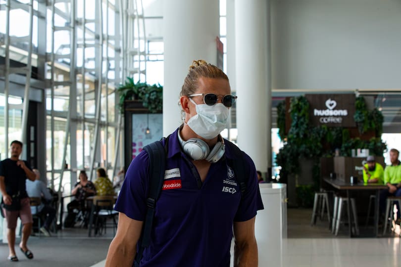 A masked up Nat Fyfe at Perth Airport.