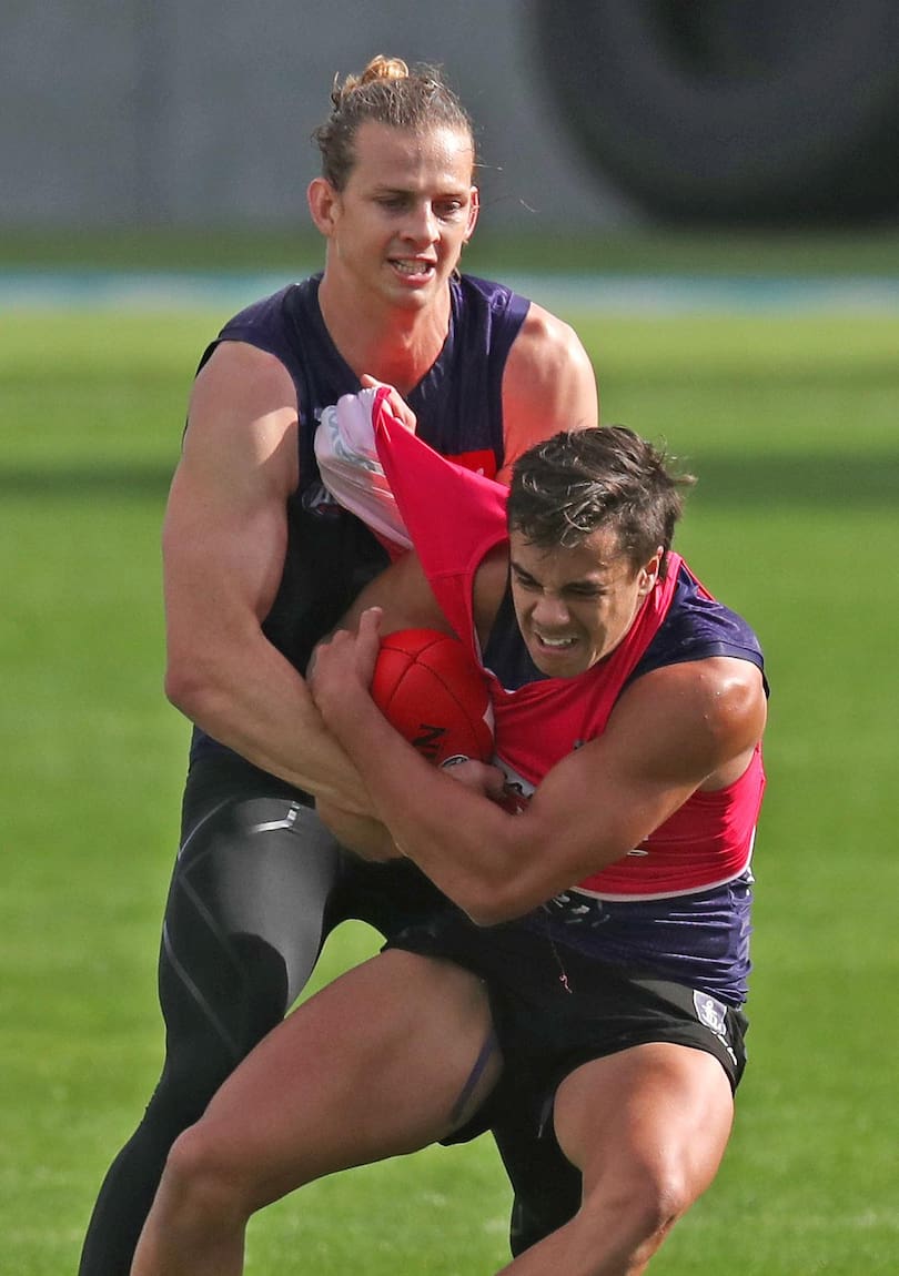 Youngster Jarvis Pina tries to spin away from Nat Fyfe.