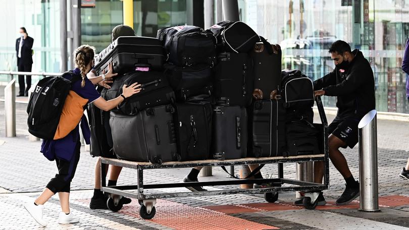 Fremantle stuff transport player luggage into Perth airport.