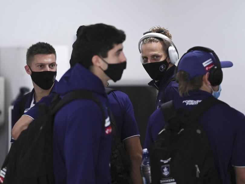 Fremantle captain Nat Fyfe waits to be scanned by security.