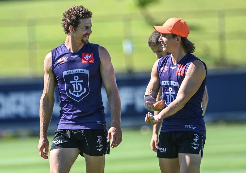 Nat Fyfe and [PLAYERCARD]Caleb Serong[/PLAYERCARD] have a chat at training.