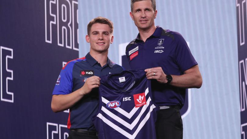 [PLAYERCARD]Caleb Serong[/PLAYERCARD] with [PLAYERCARD]Justin Longmuir[/PLAYERCARD] after being drafted by the Dockers with pick 8 in 2019. 