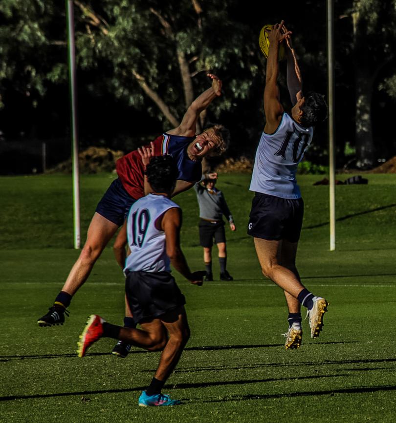 Guildford Grammar's Lewis Zolnier-Owens takes a strong mark during his three-goal performance against Scotch College.