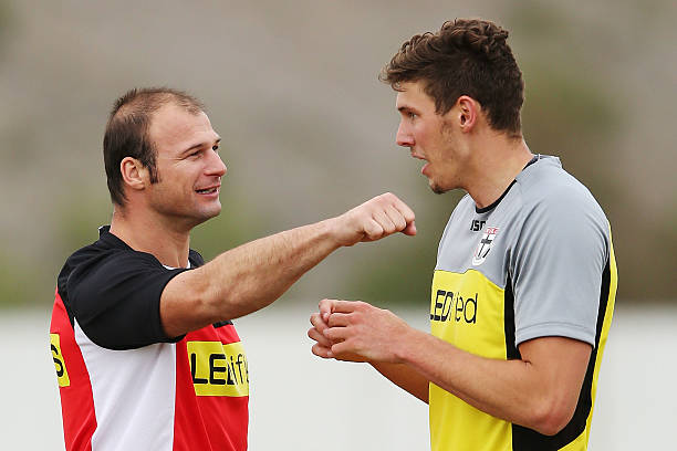 assistant-coach-aaron-hamill-gestures-to-tom-hickey-during-a-st-kilda-picture-id187291307