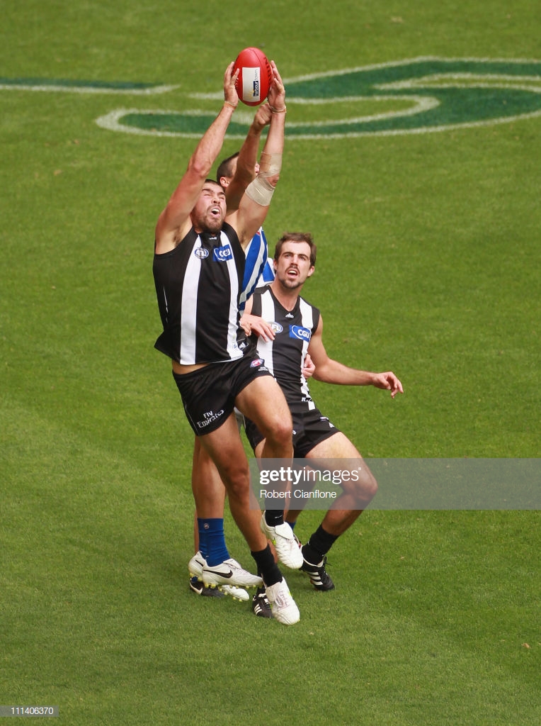 chris-dawes-of-the-magpies-marks-the-ball-during-the-round-two-afl-picture-id111406370