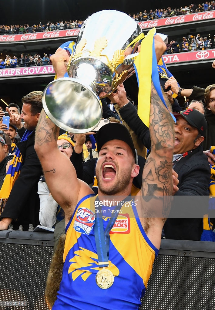 chris-masten-of-the-eagles-holds-up-the-premiership-trophy-after-the-picture-id1042813434