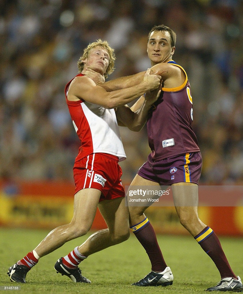 Daniel Bradshaw of the Lions and Craig Bolton of the Swans wrestle... News  Photo - Getty Images