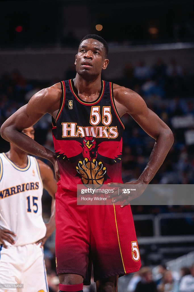 dikembe-mutombo-of-the-atlanta-hawks-looks-on-against-the-golden-on-picture-id123711959