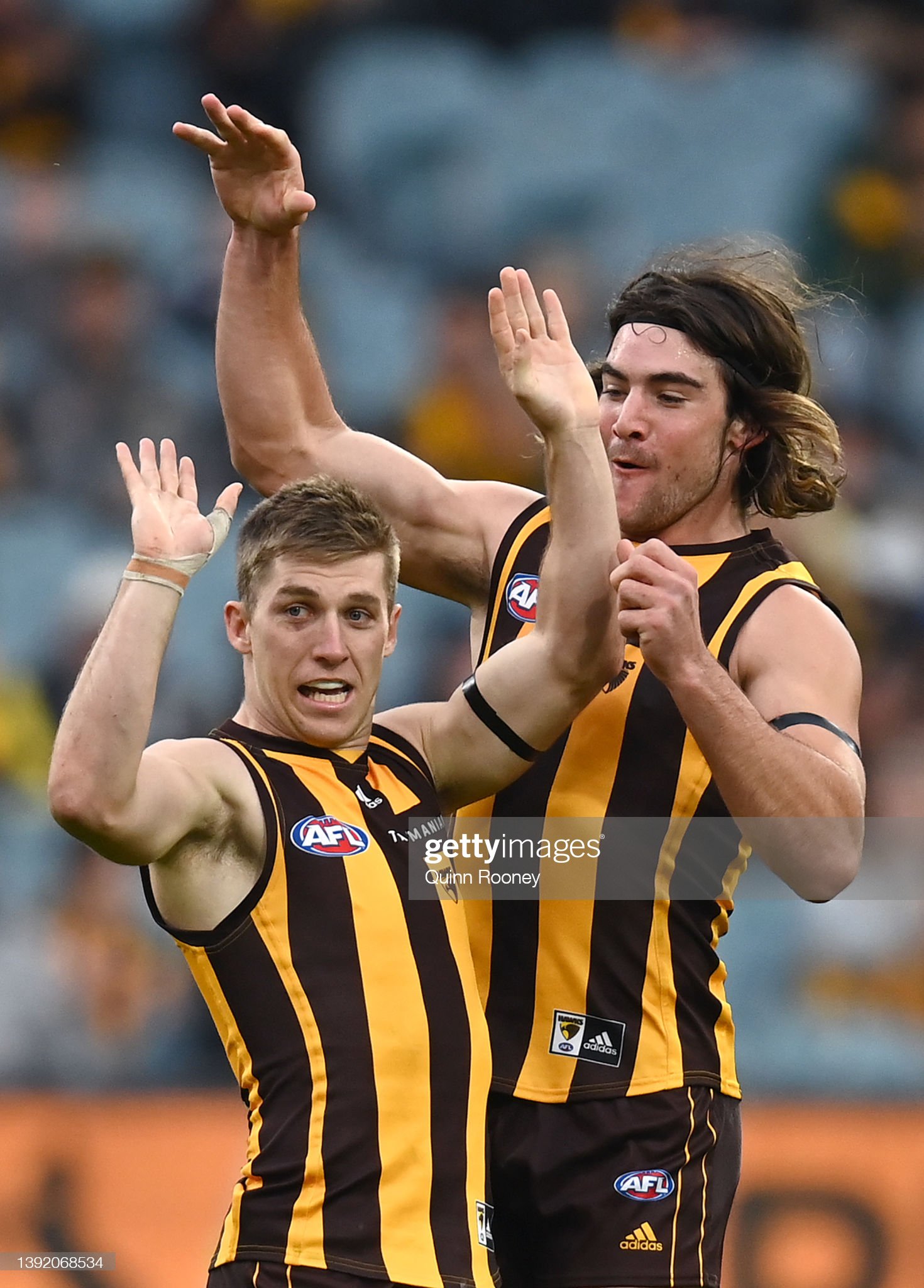 dylan-moore-of-the-hawks-is-congratulated-by-jai-newcombe-after-a-picture-id1392068534