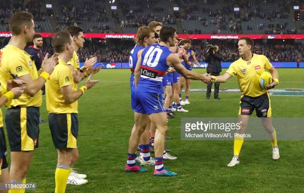 easton-wood-of-the-bulldogs-congratulates-afl-field-umpire-shane-as-picture-id1154029074