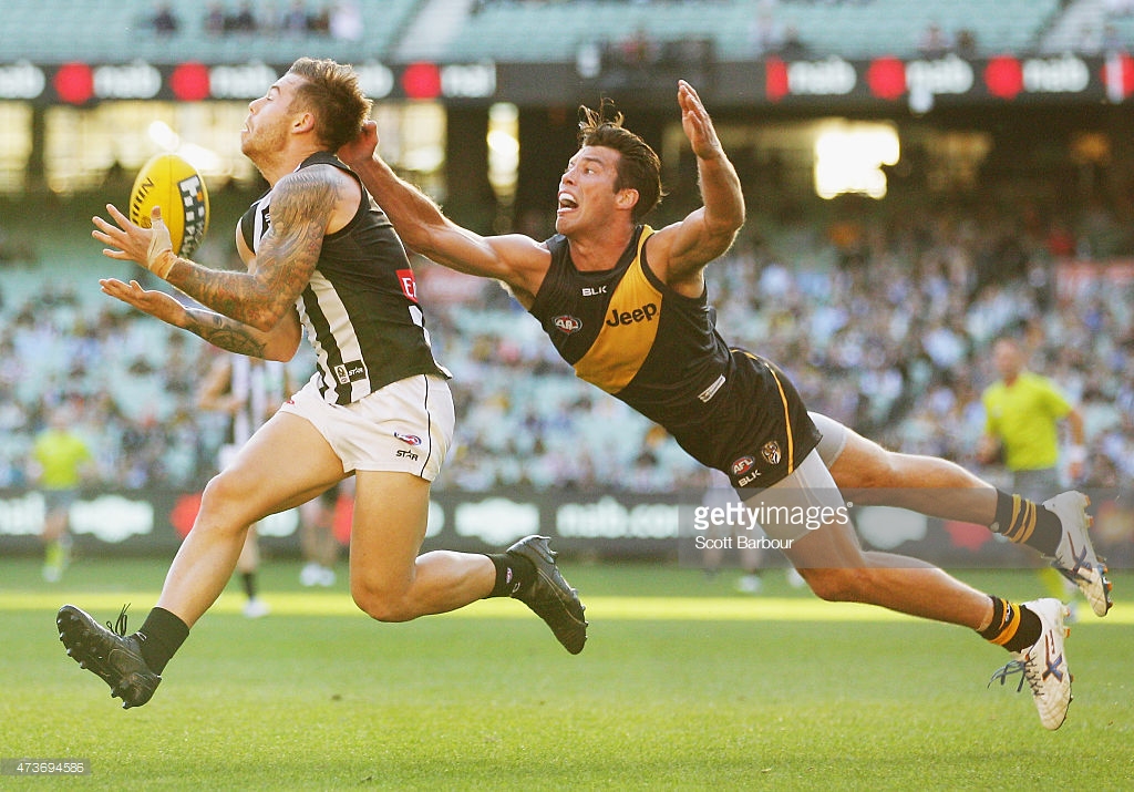 jamie-elliott-of-the-magpies-takes-a-mark-in-front-of-alex-rance-of-picture-id473694586
