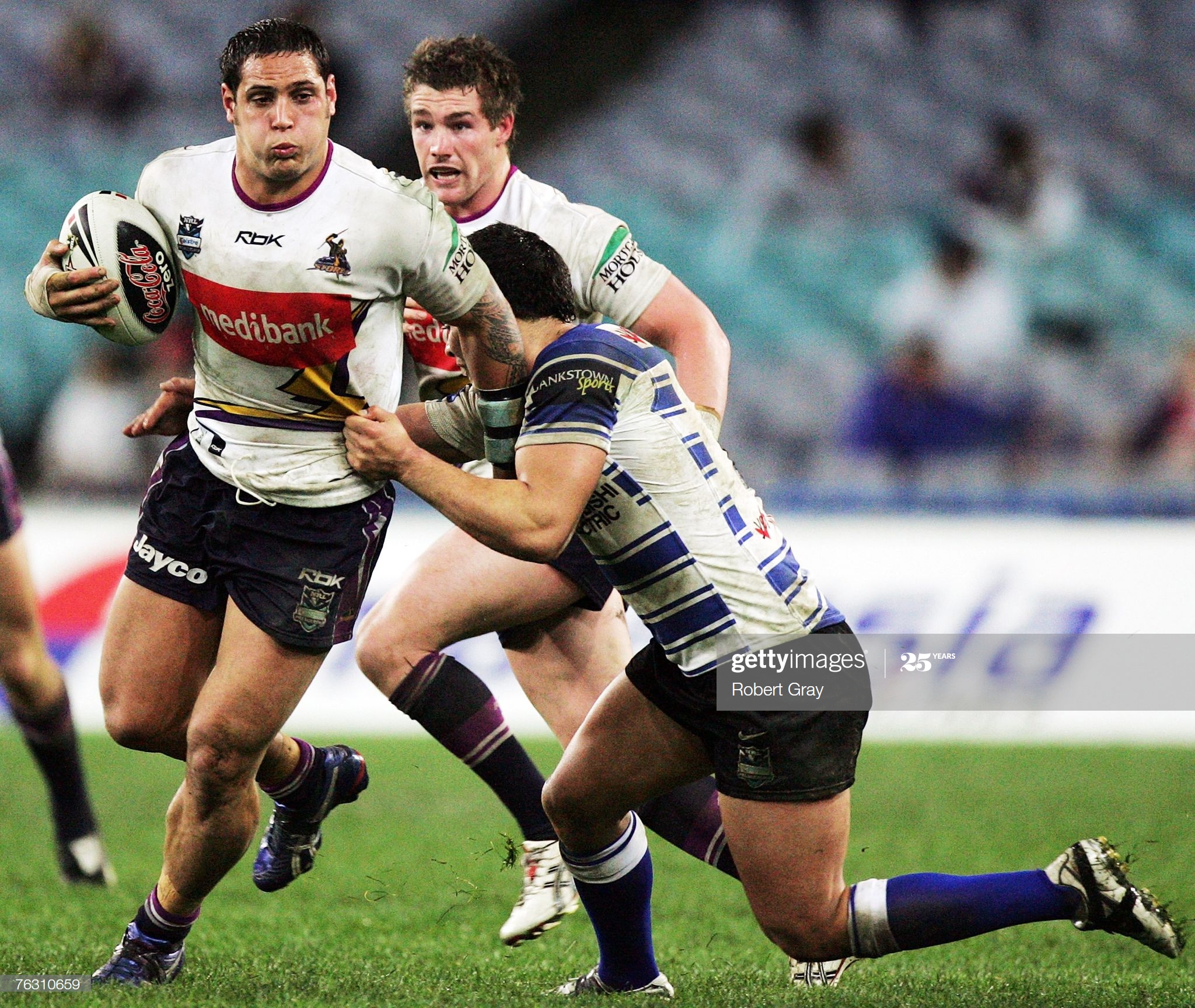 jeremy-smith-of-the-storm-is-tackled-during-the-round-24-nrl-match-picture-id76310659