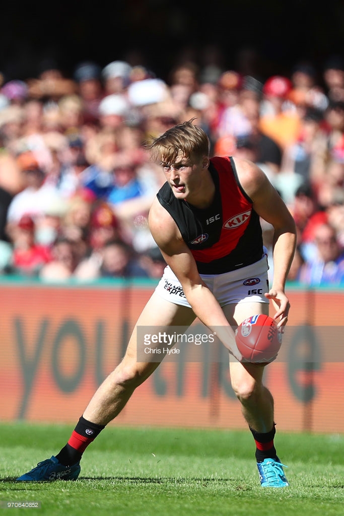 mason-redman-of-the-bombers-handballs-during-the-round-12-afl-match-picture-id970640852