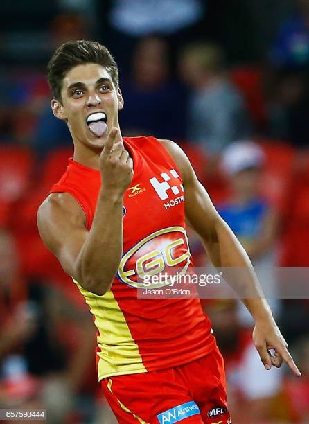 sean-lemmens-of-the-suns-kicks-a-goal-during-the-round-one-afl-match-picture-id657590444