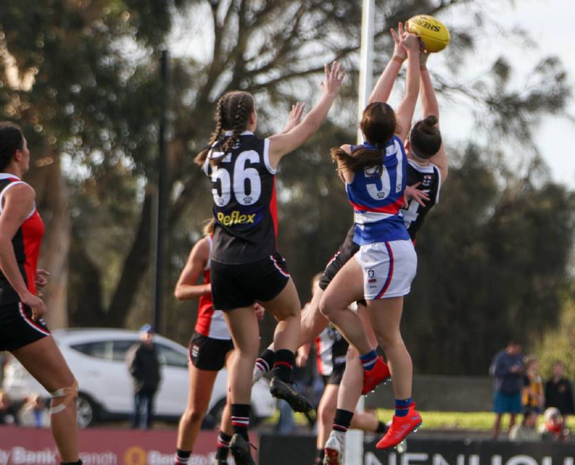 Nekaela Butler flies and lands a spoil against the Southern Saints on Sunday. Picture: ELANOR JEANNE PHOTOGRAPHY