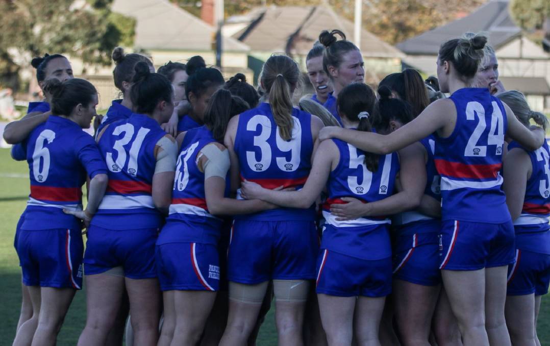 Butler (#57) listens in the huddle. Picture: ELEANOR JEANNE PHOTOGRAPHY