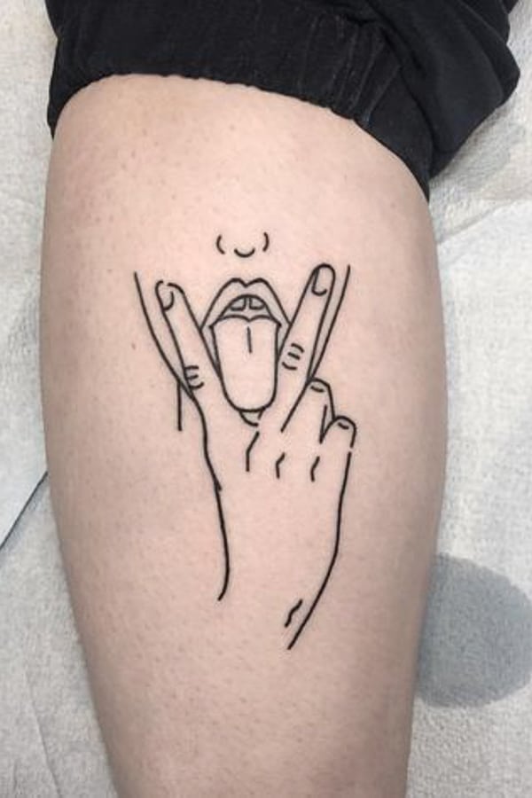 V-fingers-with-tongue-tattoo-by-curtmontgomerytattoos.jpg