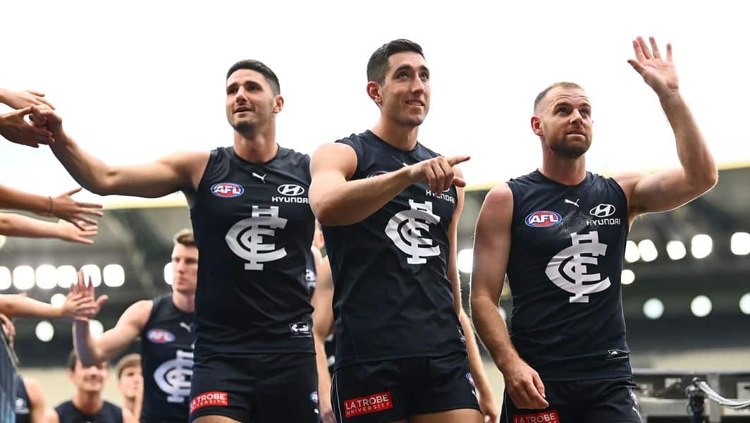 Marc-Pittonet-Jacob-Weitering-and-Sam-Docherty-walk-off-after-the-R5-clash-between-Carlton-and-Port-Adelaide-on-April-17-2022.JPG