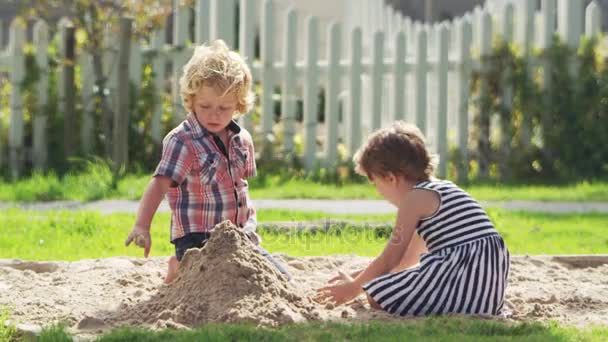 depositphotos_168165116-stock-video-kids-playing-in-sand-pit.jpg