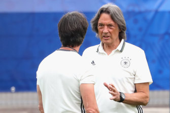 Hans-Wilhelm Mueller-Wohlfahrt (right) with German national soccer coach Joachim Low at Euro 2016.