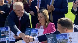 Prime Minister Scott Morrison, Queensland Premier Annastacia Palaszczuk  and Brisbane lord mayor Adrian Schrinner signing the SEQ City Deal at the Gabba.