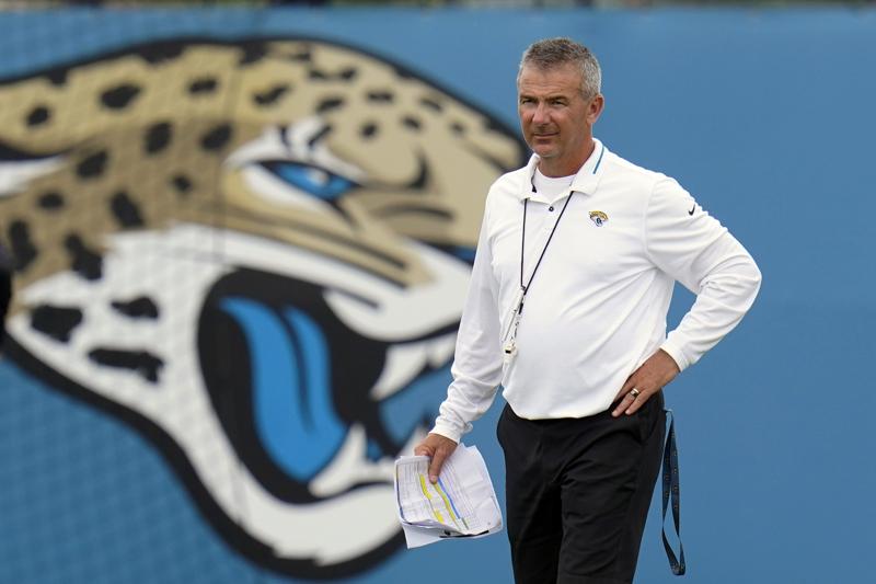 FILE - Jacksonville Jaguars head coach Urban Meyer watches players perform drills during an NFL football practice in Jacksonville, Fla., in this Monday, June 14, 2021, file photo. The Jacksonville Jaguars said Wednesday, July 14, 2021,  that coach Urban Meyer and general manager Trent Baalke were subpoenaed as part of a lawsuit filed by lawyers for Black players suing former Iowa strength coach Chris Doyle for discrimination. (AP Photo/John Raoux, File)