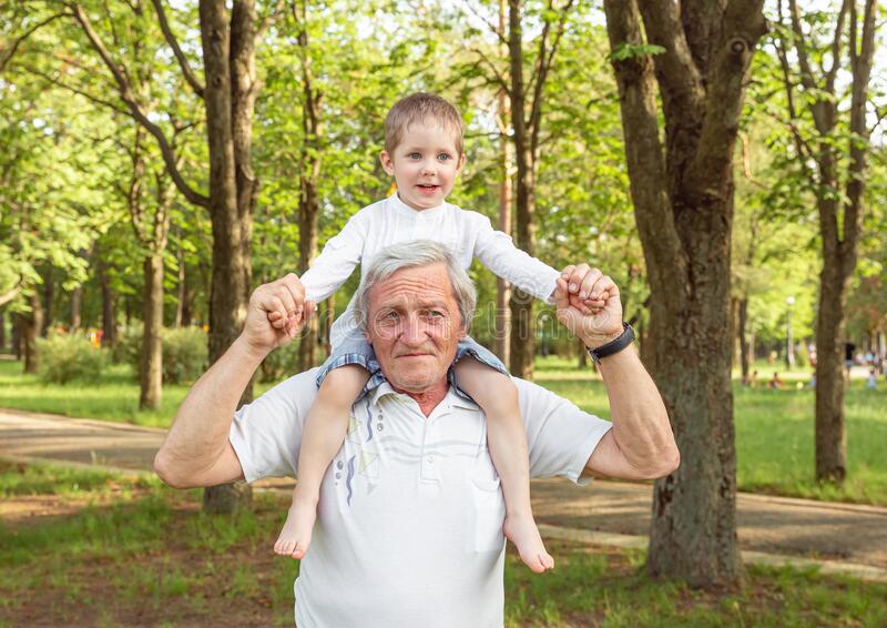 senior-man-toddler-boy-spending-time-nature-summer-laughing-little-grandson-having-fun-happy-child-sitting-grandpa-193296904.jpg