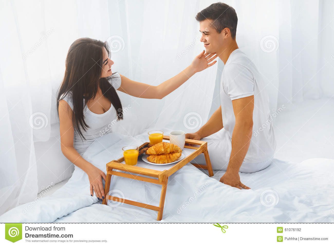 husband-serving-wife-breakfast-bed-young-handsome-his-beautiful-happy-love-care-relationships-concepts-61076192.jpg