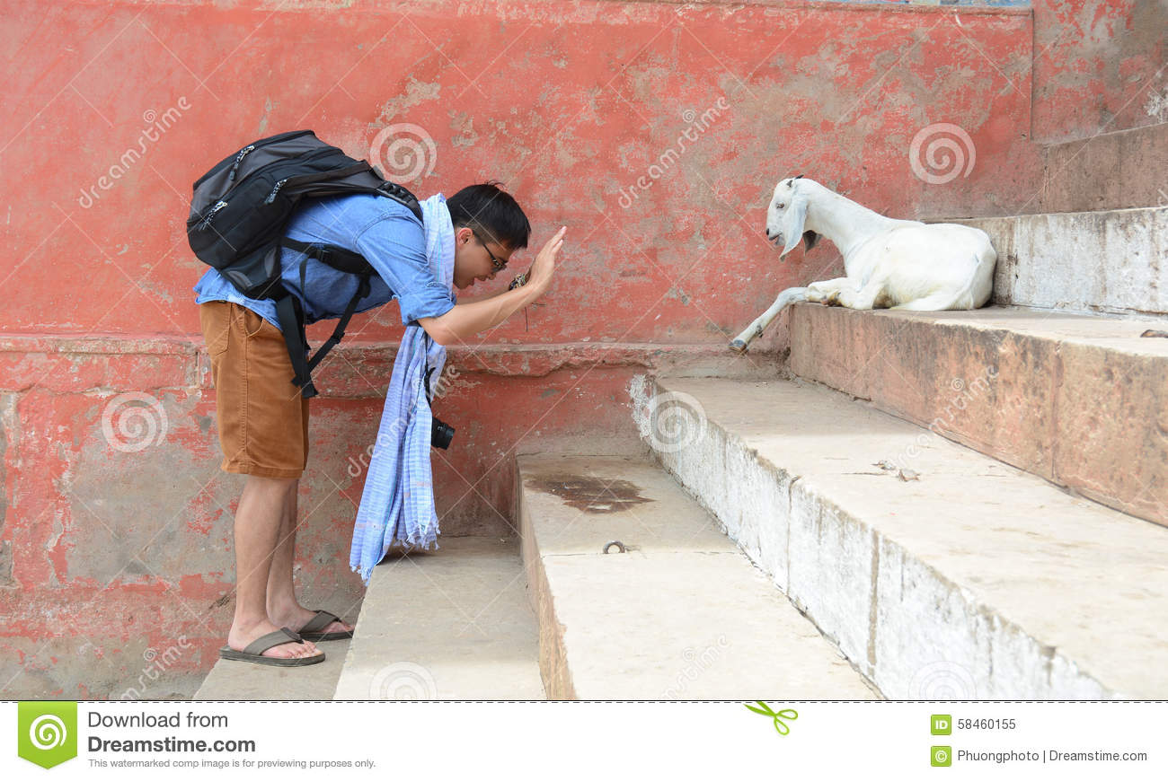 man-goat-steps-ghat-varanasi-india-jul-unidentified-pilgrim-india-58460155.jpg