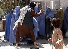 220px-Taliban_beating_woman_in_public_RAWA.jpg