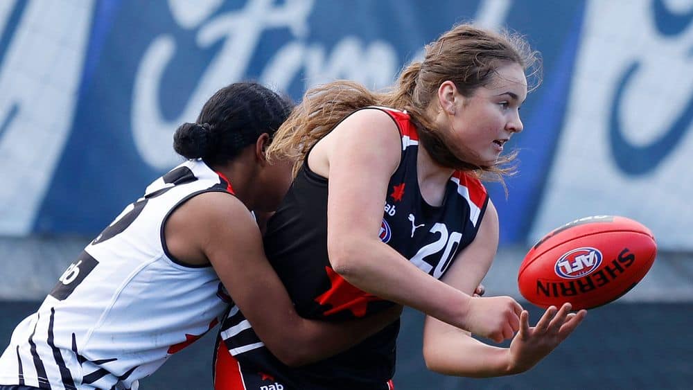 Georgia-Clark-of-Team-Black-handballs-in-the-NAB-AFLW-Futures-match-on-June-5-2022.JPG