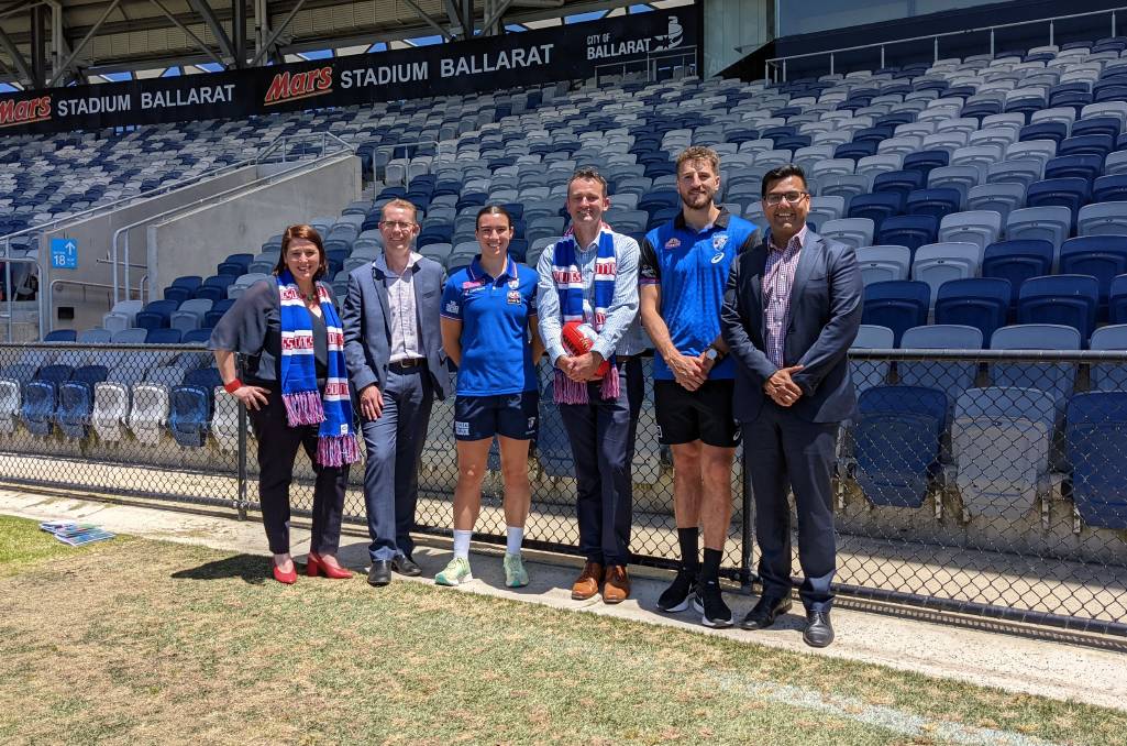 RECOMITTED: Member for Wendouree Juliana Addison, City of Ballarat CEO Evan King and mayor Daniel Moloney with Western Bulldogs players Bonnie Toogood, [PLAYERCARD]Marcus Bontempelli[/PLAYERCARD] and chief executive Ameet Bains.