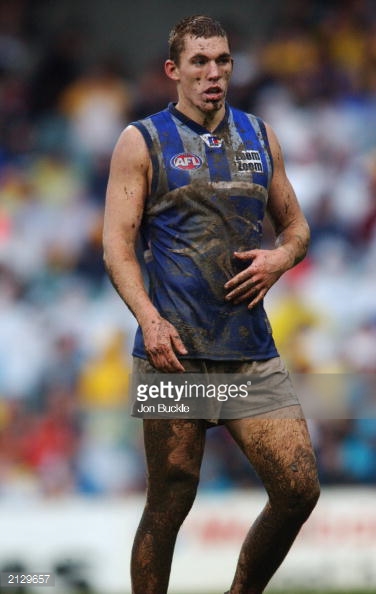 2129657-drew-petrie-of-the-kangaroos-shows-the-effects-gettyimages.jpg